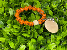 Load image into Gallery viewer, Sports Ball Wooden Wristlet