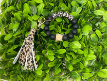 Load image into Gallery viewer, Black Leopard Wristlet with Leopard Tassel
